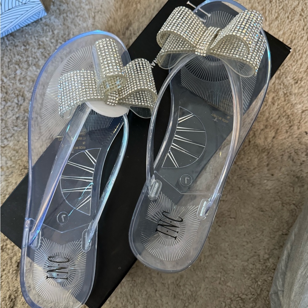 INC sandals. Clear with rhinestone bows